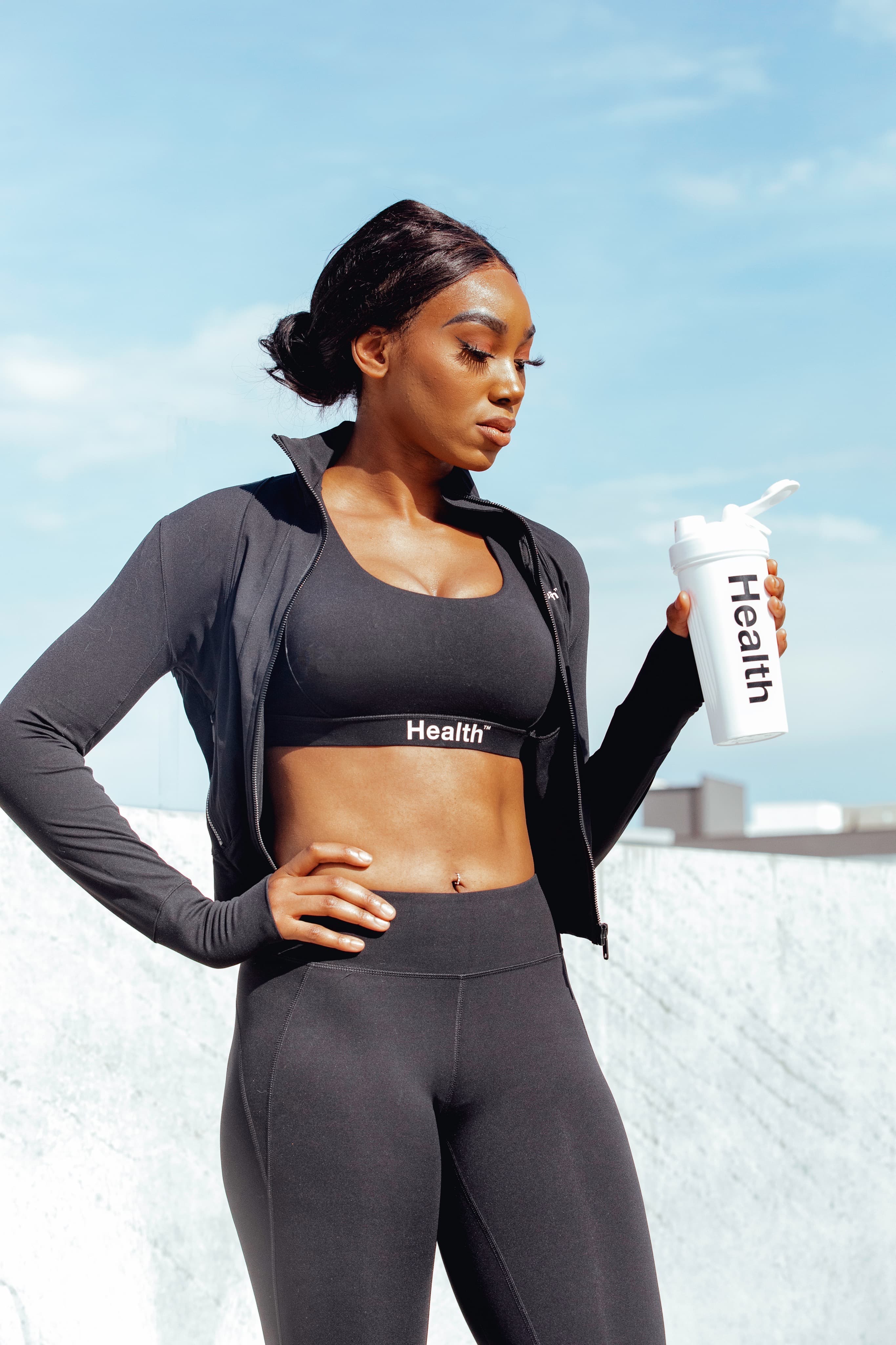 Health® athlete wearing the black Health® activewear collection